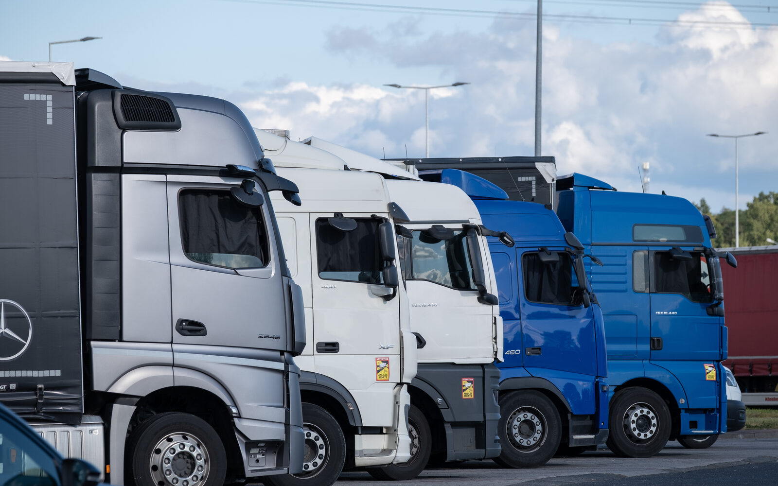 Heavy goods vehicles parked in a line